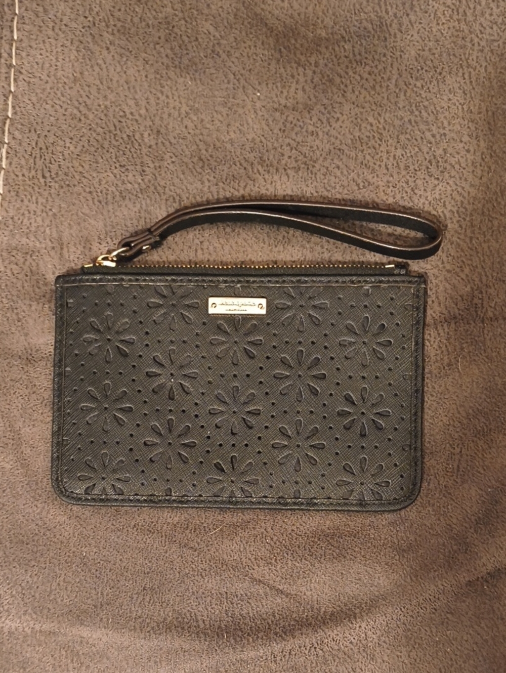 Kate Spade Black floral cutout wristlet with gold plaque
